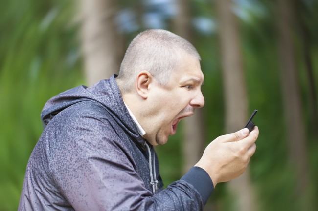 angry-man-screams-at-phone