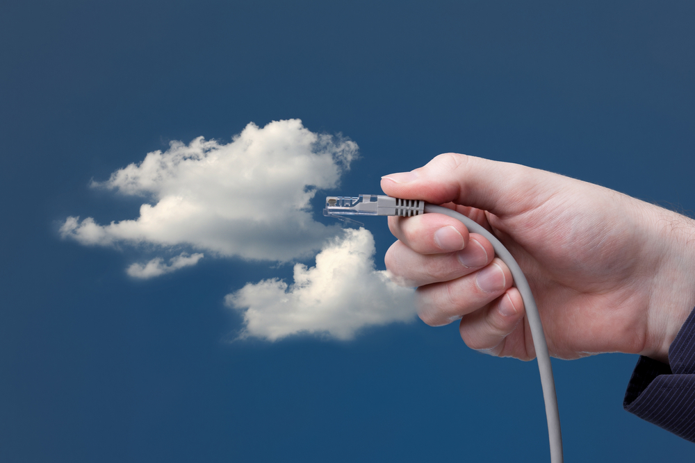 Cloud computing concept. Hand with ethernet cable connecting into cloud. class="wp-image-223212" 