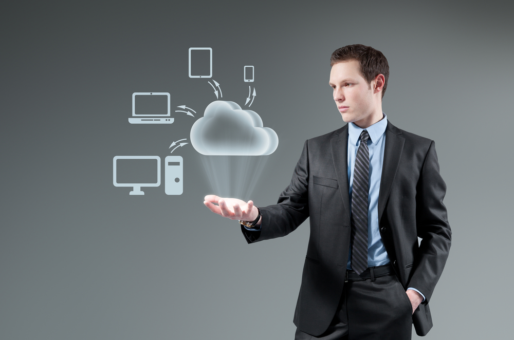 Cloud computing idea concept. Man holding cloud Hologram. class="wp-image-223202" 