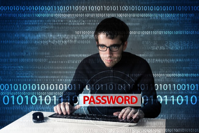 Young geek hacker stealing password on futuristic background class="wp-image-218950" 