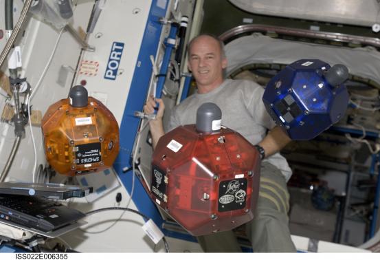 Handout photo of NASA astronaut Williams performing a check of the SPHERES in the Destiny laboratory of the International Space Station