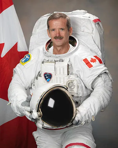384px-Chris_Hadfield_2011 class="wp-image-499297" 